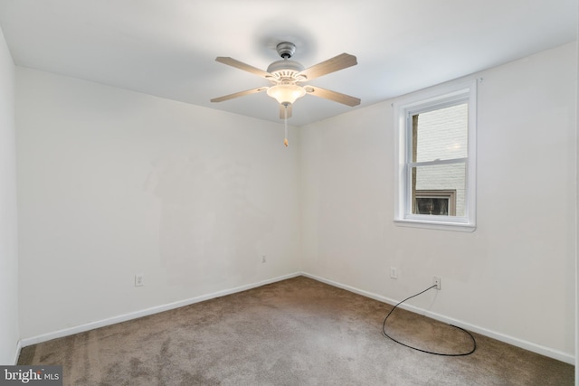 unfurnished room featuring ceiling fan and carpet floors