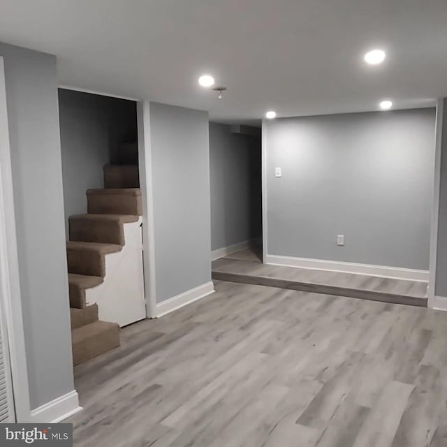 basement with light wood-type flooring