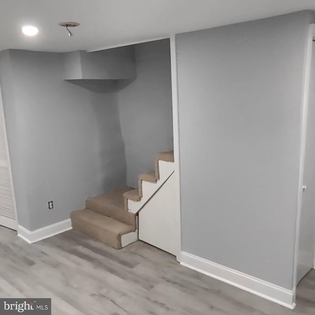 basement featuring light wood-type flooring