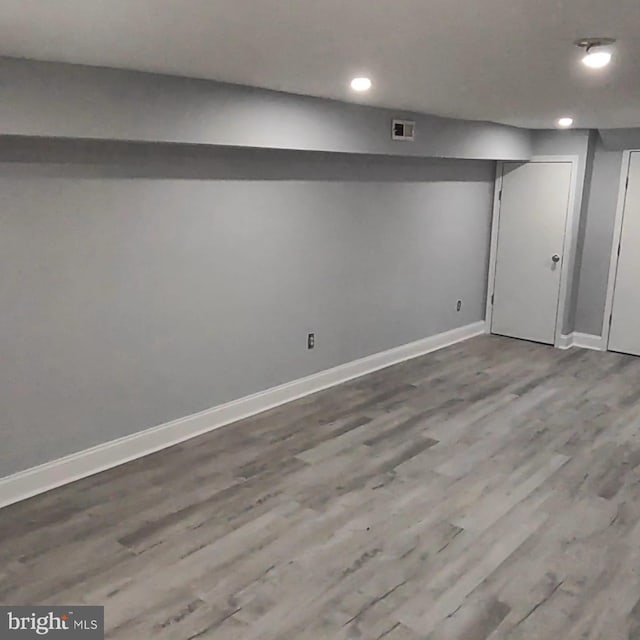 basement with wood-type flooring