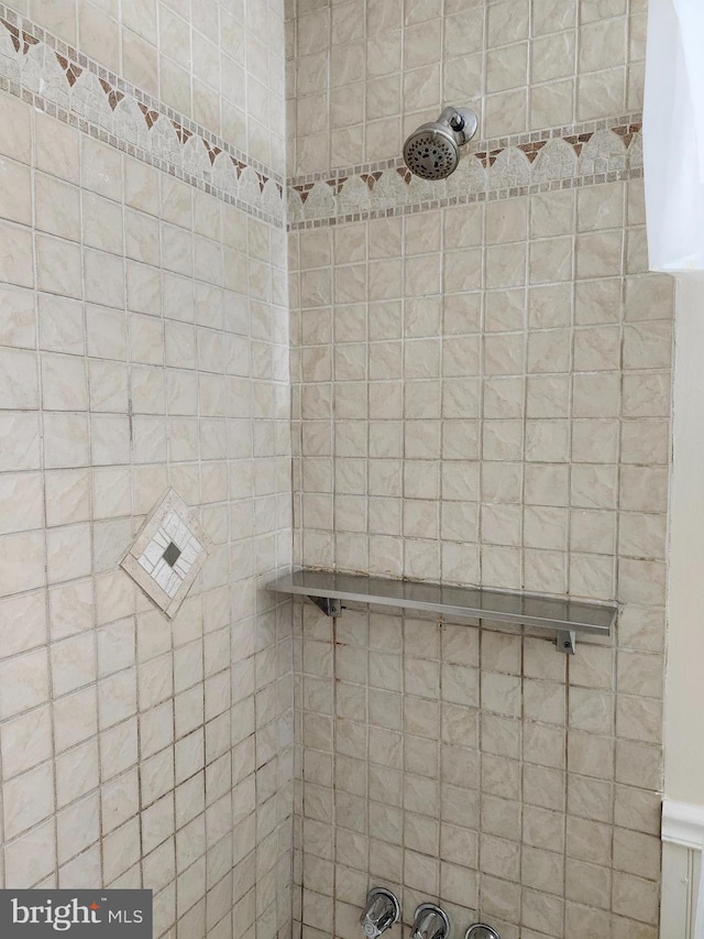 bathroom with tiled shower