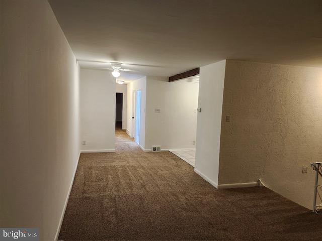 hallway with carpet