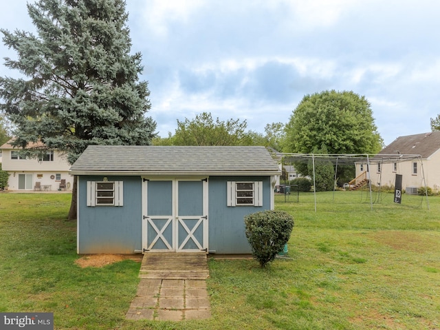 view of outdoor structure featuring a yard