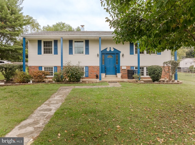 raised ranch featuring a front yard