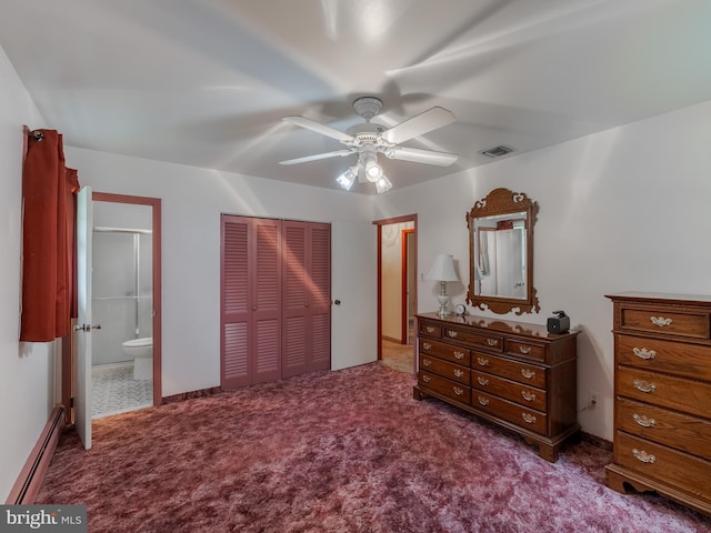 carpeted bedroom with ceiling fan, a closet, ensuite bathroom, and a baseboard heating unit