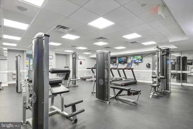 exercise room with a drop ceiling