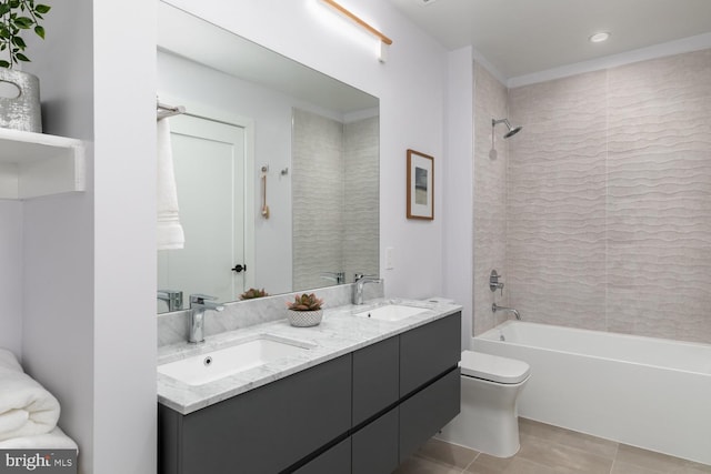 full bathroom with tiled shower / bath combo, tile patterned floors, crown molding, vanity, and toilet