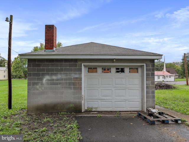 garage with a lawn