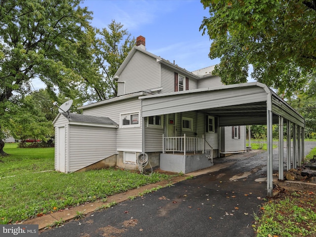 exterior space with a porch and a front lawn