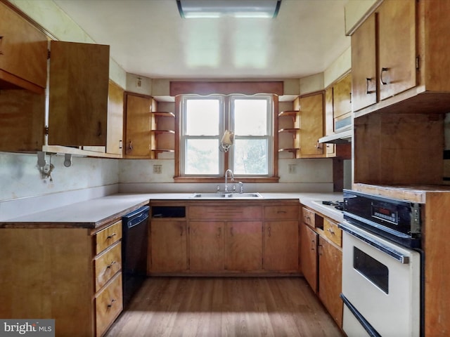 kitchen featuring white appliances, light hardwood / wood-style floors, tasteful backsplash, and sink