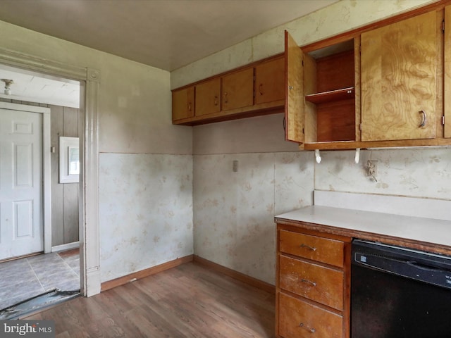 kitchen featuring dishwasher and light wood-type flooring