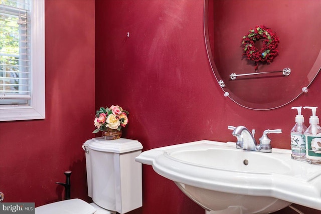 bathroom with sink and toilet