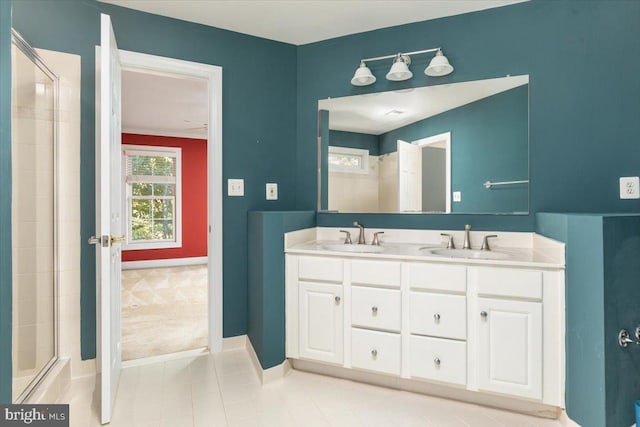 bathroom featuring ornamental molding, tile patterned flooring, walk in shower, and vanity