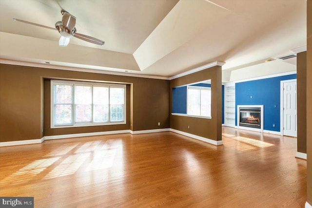 unfurnished living room featuring ornamental molding, hardwood / wood-style floors, and ceiling fan