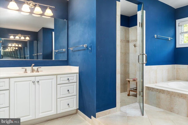 bathroom with vanity, plus walk in shower, and tile patterned flooring