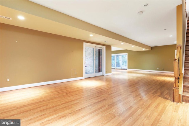 unfurnished living room featuring light hardwood / wood-style floors