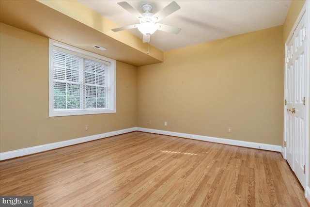 unfurnished room with ceiling fan and light hardwood / wood-style flooring