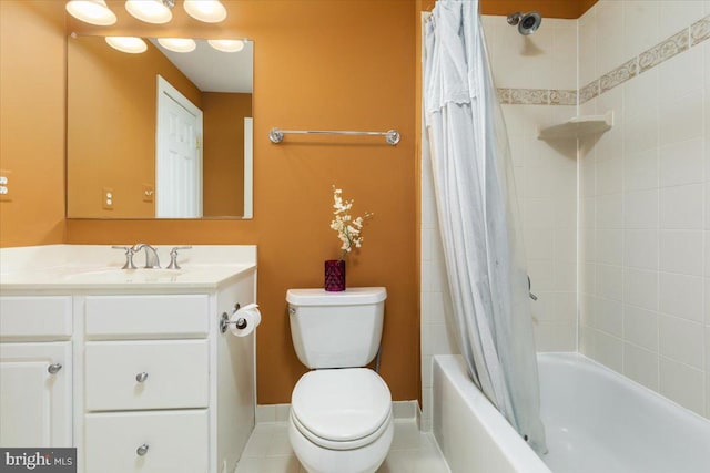 full bathroom featuring toilet, vanity, shower / bath combo with shower curtain, and tile patterned floors