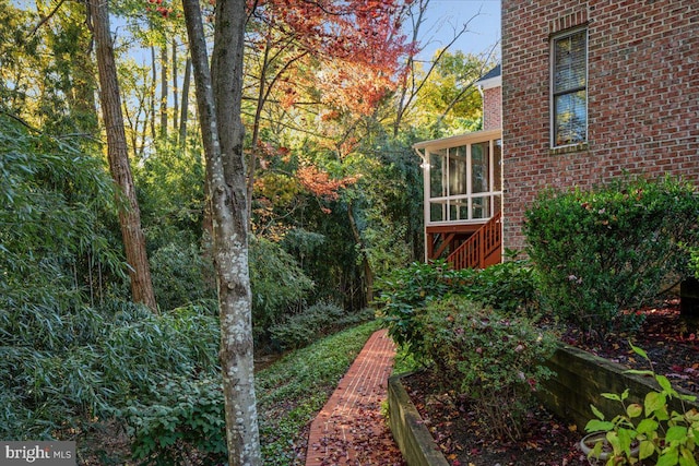 view of yard with a sunroom