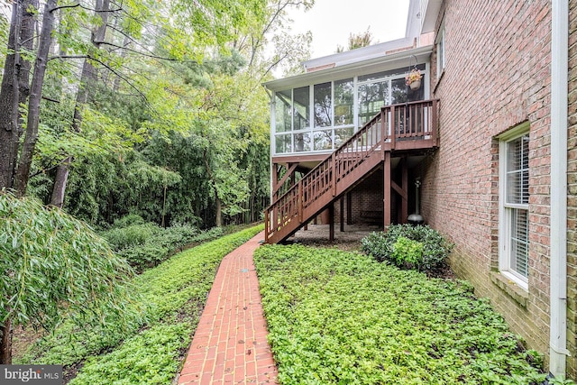 exterior space featuring a sunroom