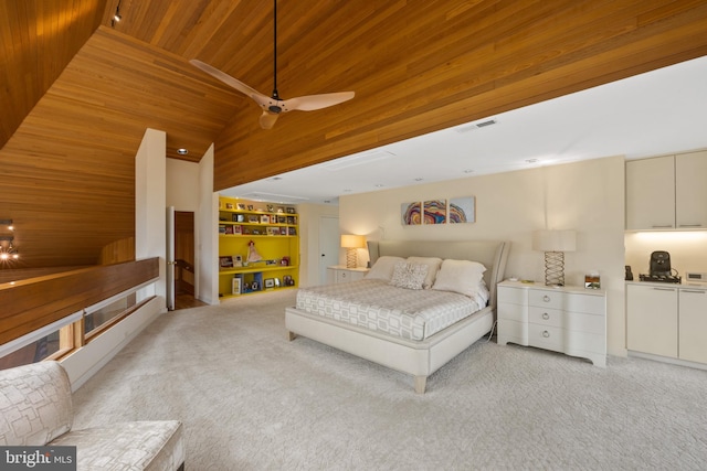 carpeted bedroom with ceiling fan, wood ceiling, and vaulted ceiling