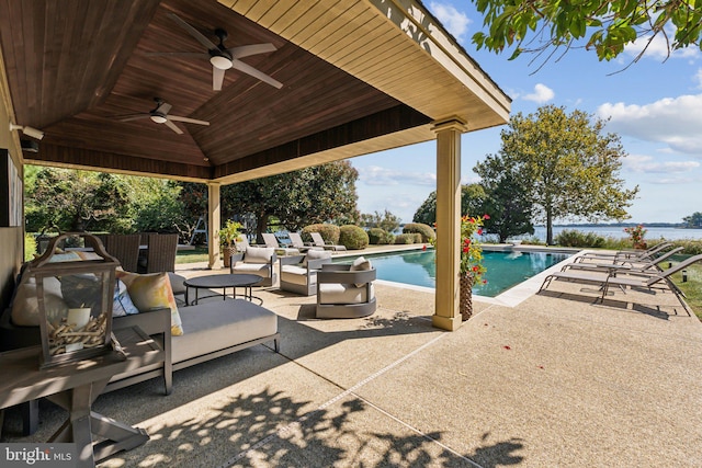 view of pool featuring a patio area, ceiling fan, and outdoor lounge area