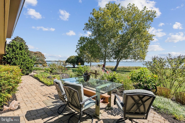 view of patio featuring a water view