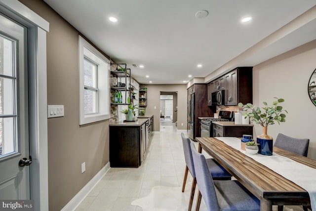 dining space with light tile patterned floors