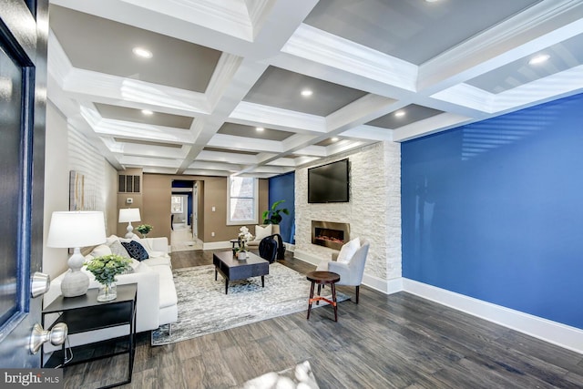 living room featuring coffered ceiling, beamed ceiling, a fireplace, and dark wood-type flooring