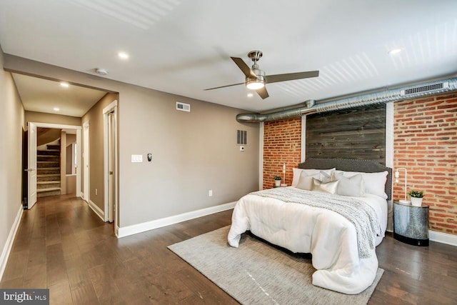 bedroom with ceiling fan and dark hardwood / wood-style flooring