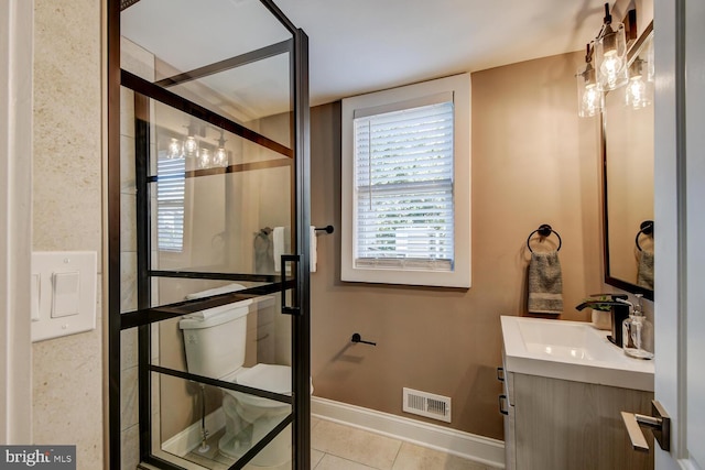 bathroom with vanity and tile patterned flooring