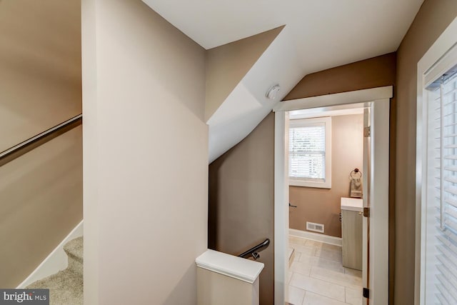 bathroom with tile patterned floors