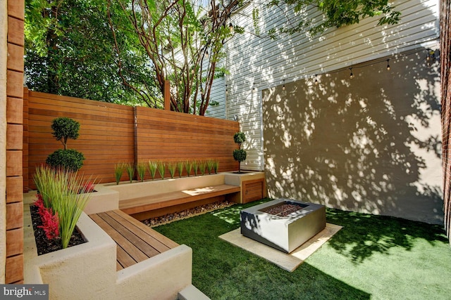 view of patio featuring an outdoor fire pit