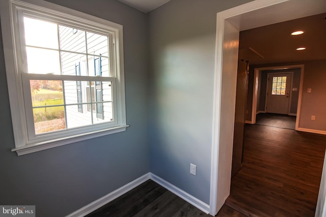 hall with baseboards, recessed lighting, and dark wood finished floors