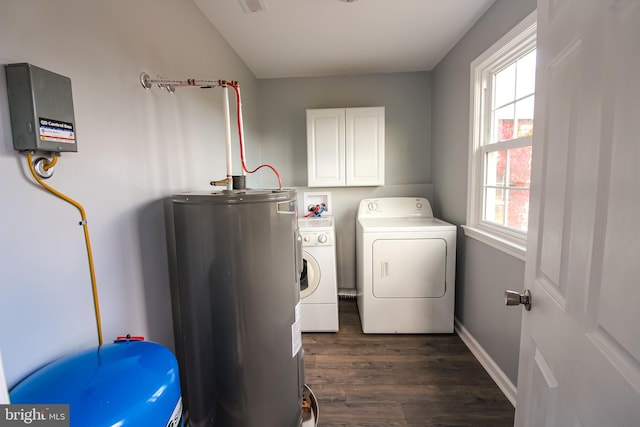 laundry room featuring baseboards, dark wood-type flooring, cabinet space, electric water heater, and washer and clothes dryer