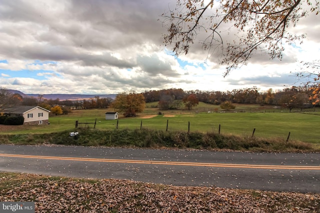 view of street featuring a rural view and a mountain view