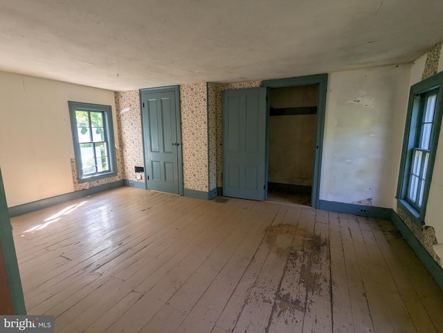 empty room with hardwood / wood-style floors