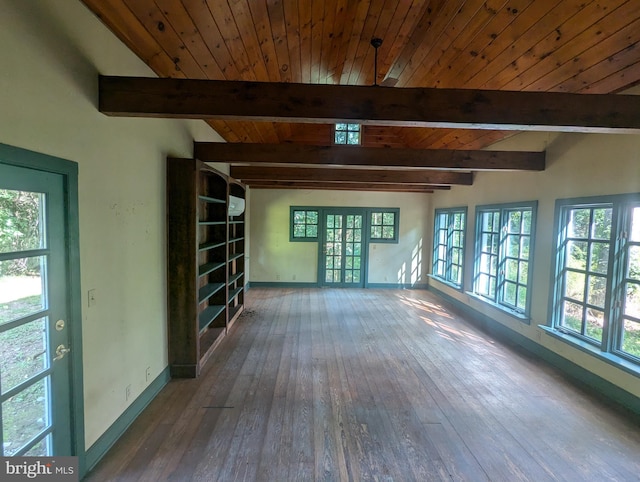 spare room with wood ceiling, hardwood / wood-style floors, beamed ceiling, and a wealth of natural light