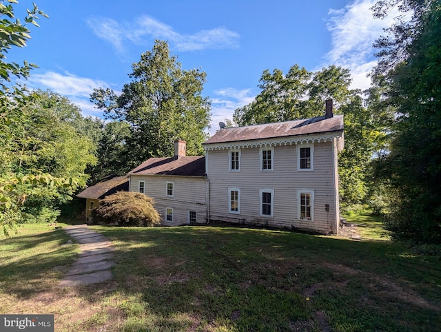 view of property exterior featuring a yard