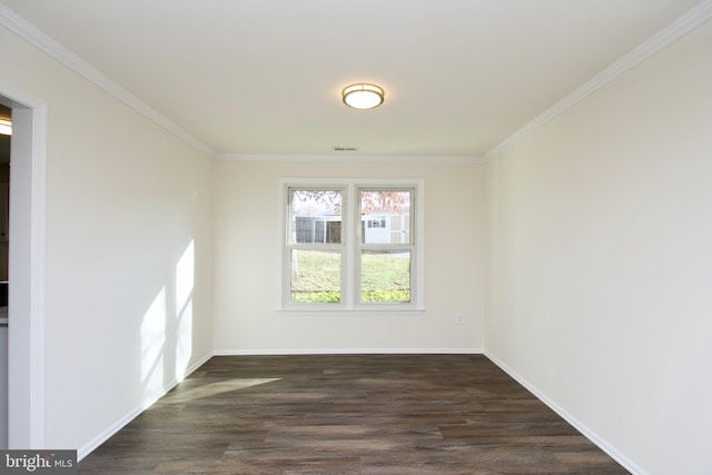 empty room with crown molding and dark wood-type flooring