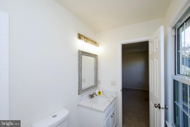 bathroom with vanity and toilet