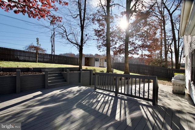 deck featuring a grill