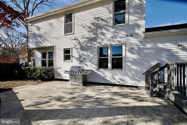 back of property featuring a patio area