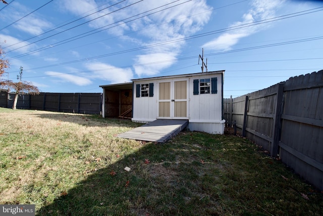 view of outdoor structure featuring a lawn