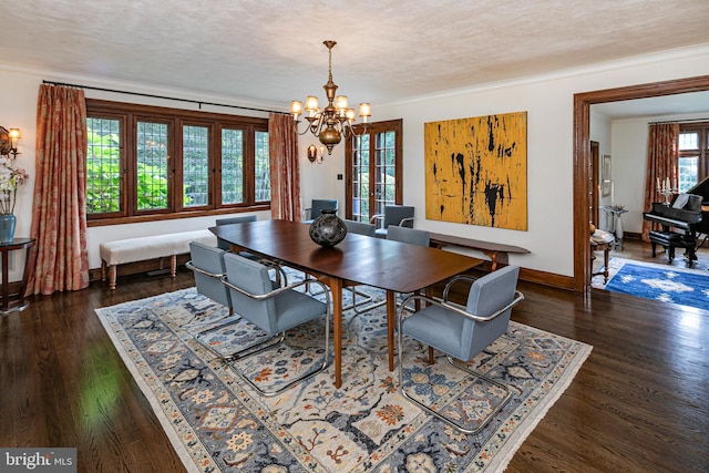 dining room featuring crown molding, a chandelier, dark hardwood / wood-style floors, and a textured ceiling