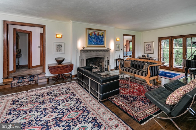 living room featuring a textured ceiling, crown molding, and hardwood / wood-style floors