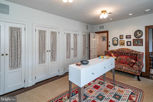 office featuring french doors and dark hardwood / wood-style flooring