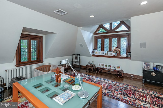 interior space with french doors, vaulted ceiling, and hardwood / wood-style floors