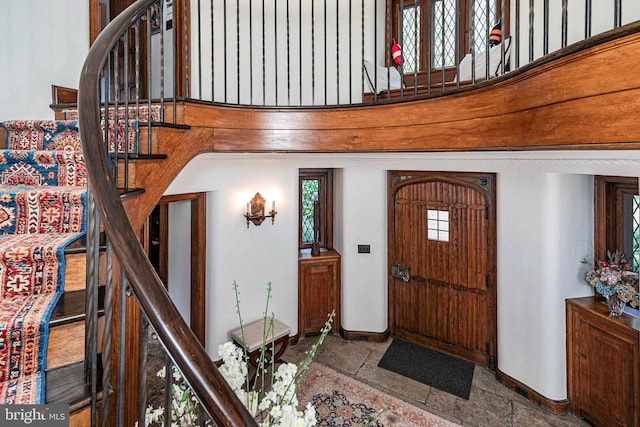 94 N Rd, Princeton, NJ 08540 - foyer entrance featuring baseboards, stone tile floors, and stairs