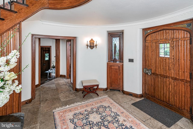 entrance foyer featuring crown molding